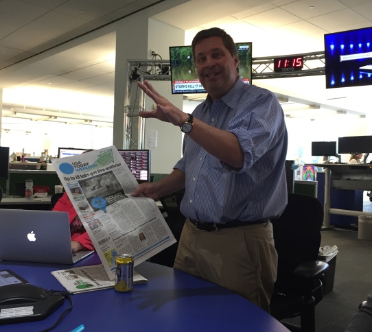 Editor in Chief David Callaway with print paper of bio lab story